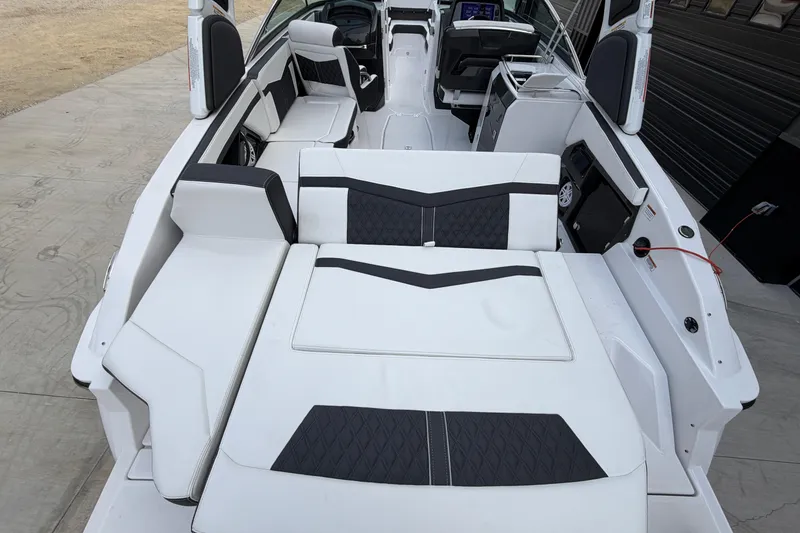 Slide: The Image of 2025 Monterey 278SS Super Sport boat on trailer, parked outdoors on a sunny day. - 4