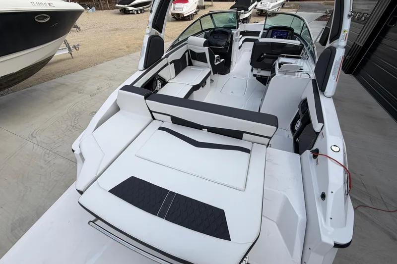 Slide: The Image of 2025 Monterey 278SS Super Sport boat interior with sleek white and black seating design. - 5