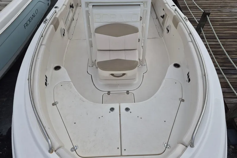 Slide: The Image of 2017 Robalo R222 Center Console boat interior with seating and storage compartments. - 11