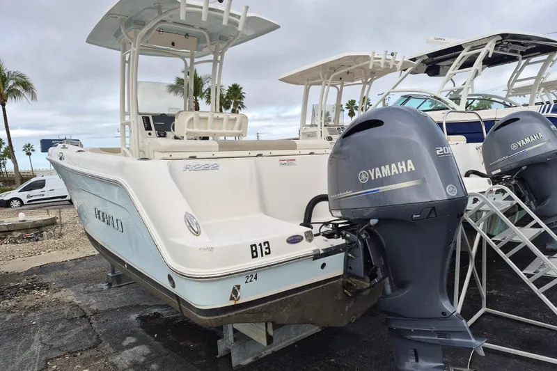 Slide: The Image of 2017 Robalo R222 Center Console boat with Yamaha outboard engines, parked on a trailer. - 4