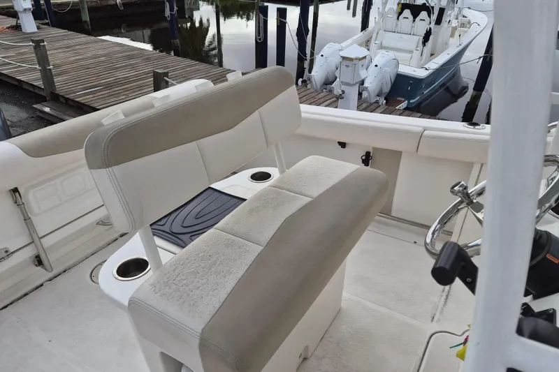 Slide: The Image of 2017 Robalo R222 Center Console boat interior with seating and steering wheel. - 7