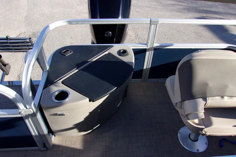 Slide: The Image of 2023 Sun Tracker Bass Buggy 18 DLX interior with seating and console. - 10