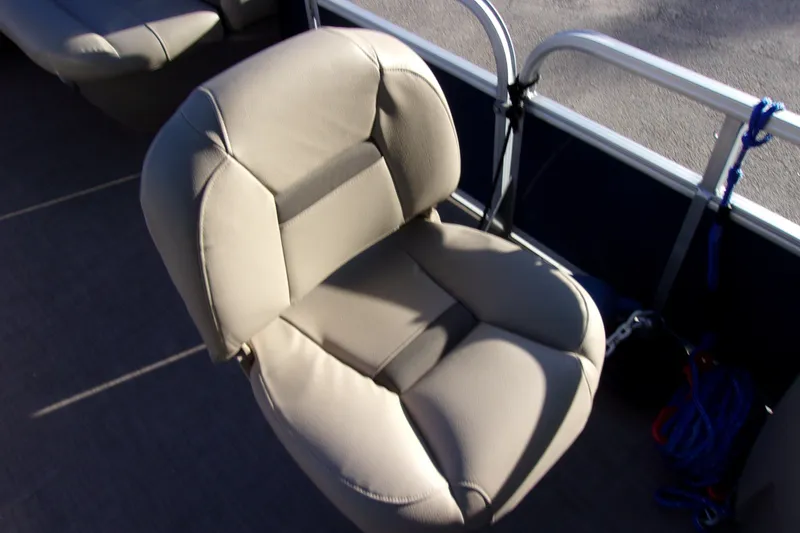 Slide: The Image of 2023 Sun Tracker Bass Buggy 18 DLX boat seat, beige upholstery, outdoor setting. - 13