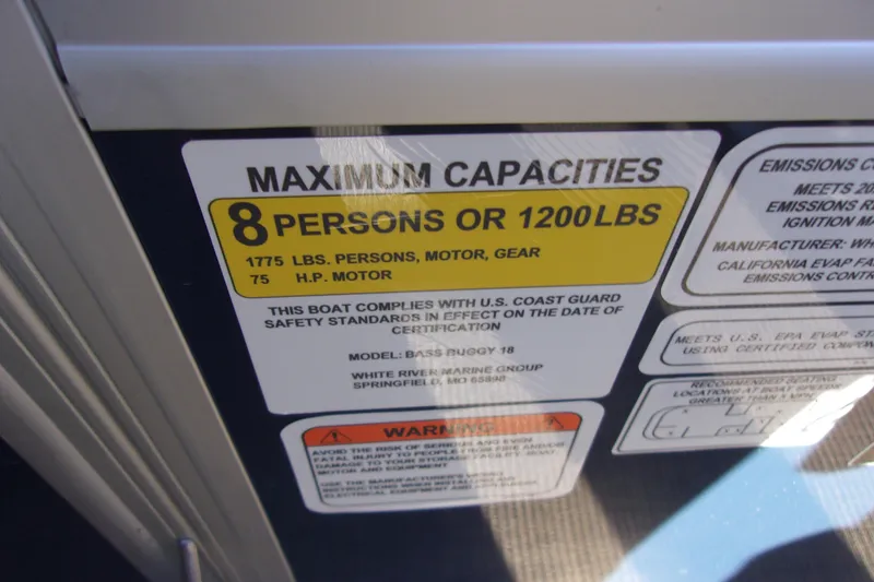 Slide: The Image of 2023 Sun Tracker Bass Buggy 18 DLX capacity label, 8 persons or 1200 lbs, 75 HP motor. - 17