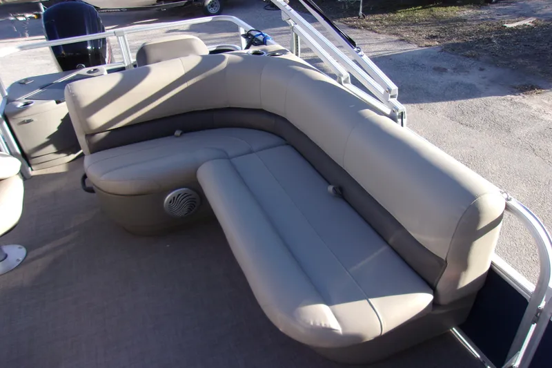 Slide: The Image of 2023 Sun Tracker Bass Buggy 18 DLX pontoon boat with beige seating. - 8