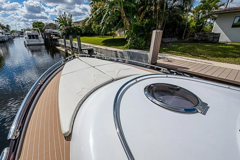 Slide: The Image of 2014 Zeelander Z44 yacht docked by a lush, tropical canal. - 10