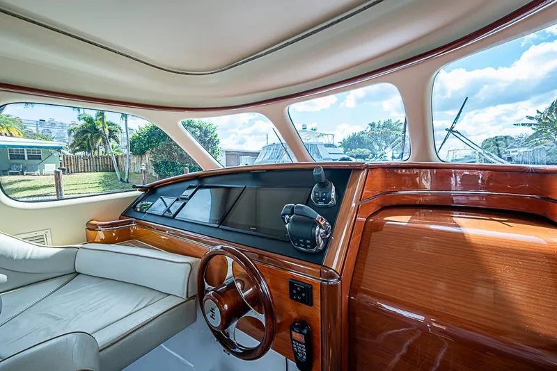 Slide: The Image of Luxurious interior of 2014 Zeelander Z44 yacht with elegant wood finish and plush seating. - 15