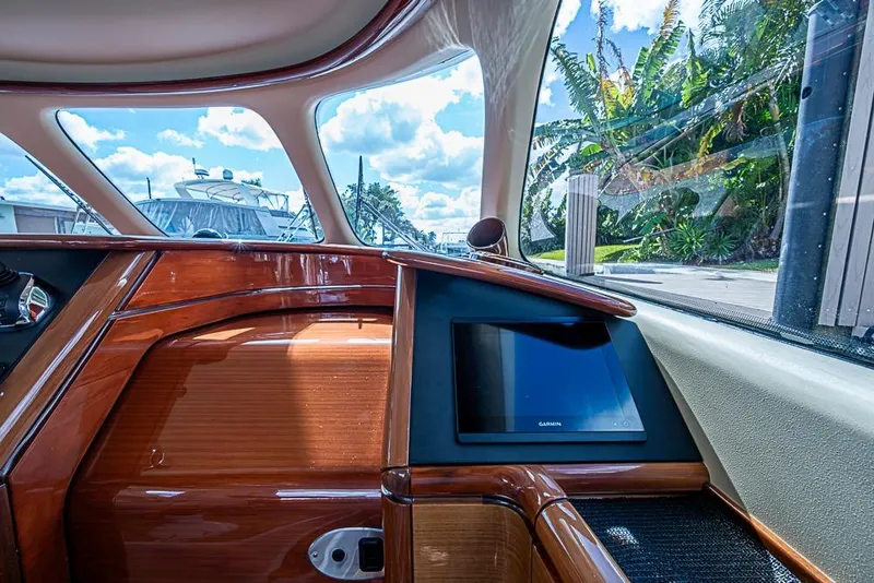 Slide: The Image of Luxurious interior of 2014 Zeelander Z44 yacht with wooden finish and navigation screen. - 16