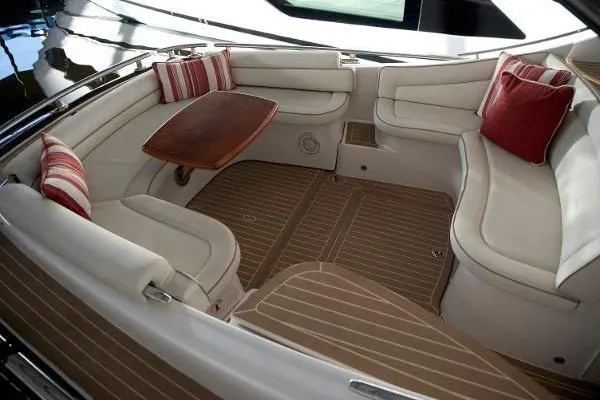 Slide: The Image of 2014 Zeelander Z44 yacht docked, featuring sleek design and vibrant red hull. - 2