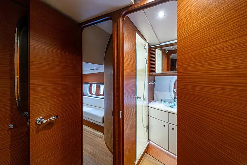 Slide: The Image of Luxurious interior of 2014 Zeelander Z44 yacht featuring wood paneling and modern bathroom. - 23