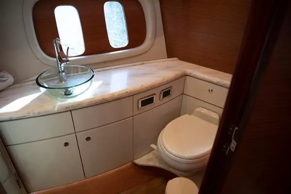 Slide: The Image of 2014 Zeelander Z44 yacht engine compartment with open hatch, docked in a scenic canal. - 7