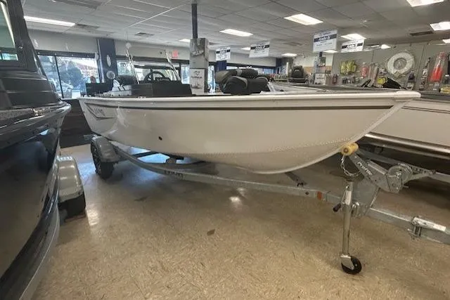The Image of 2026 Lund 1650 Rebel XL SS boat on trailer in showroom. - 0