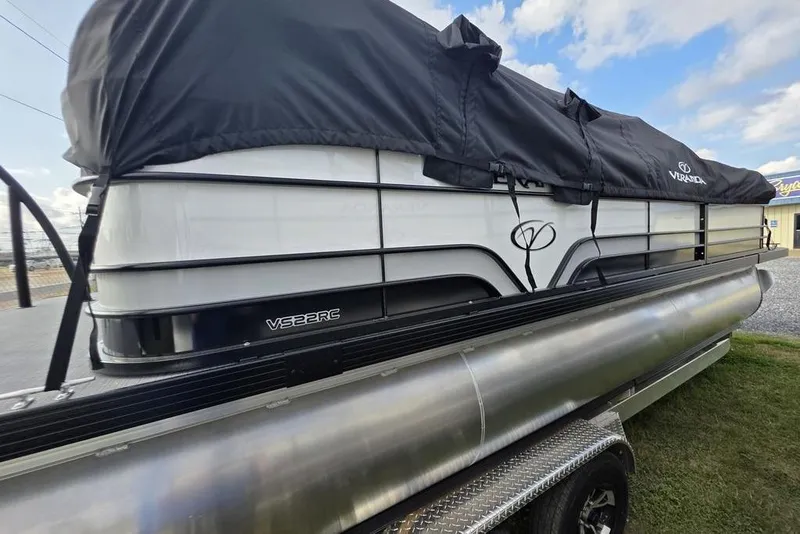 Slide: The Image of 2026 Veranda Vista Sport 22RC Tri-Toon boat with cover, side view. - 11