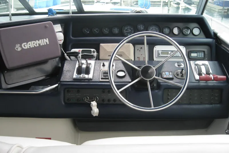 Slide: The Image of 1990 Sea Ray Sundancer 350 helm with Garmin navigation system and control panel. - 10