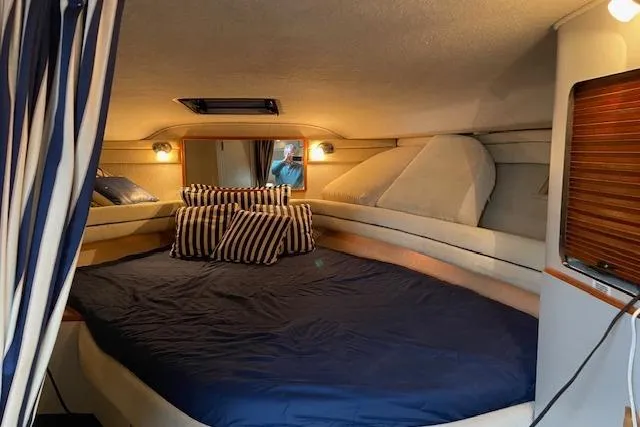 Slide: The Image of 1990 Sea Ray Sundancer 350 kitchen with stove, sink, and cabinets. - 14