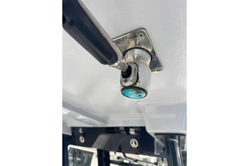 Slide: The Image of 2022 Robalo R272 Center Console boat detail, featuring a metal fixture on the ceiling. - 11