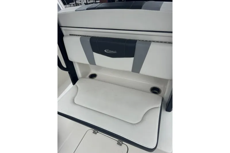 Slide: The Image of 2022 Robalo R272 Center Console boat seat with cup holders and logo. - 5