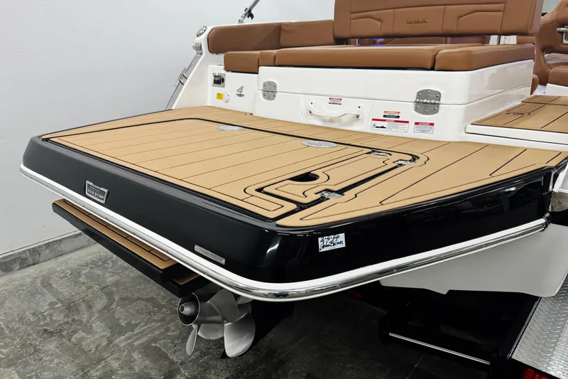 Slide: The Image of 2026 Chaparral SSX 4 boat stern with tan deck and stainless steel propeller. - 11