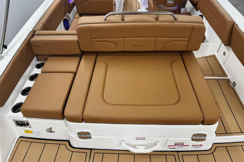 Slide: The Image of 2026 Chaparral SSX 4 boat interior with tan leather seating and modern design. - 14