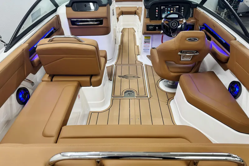 Slide: The Image of 2026 Chaparral SSX 4 boat interior with luxurious tan seating and modern dashboard. - 17