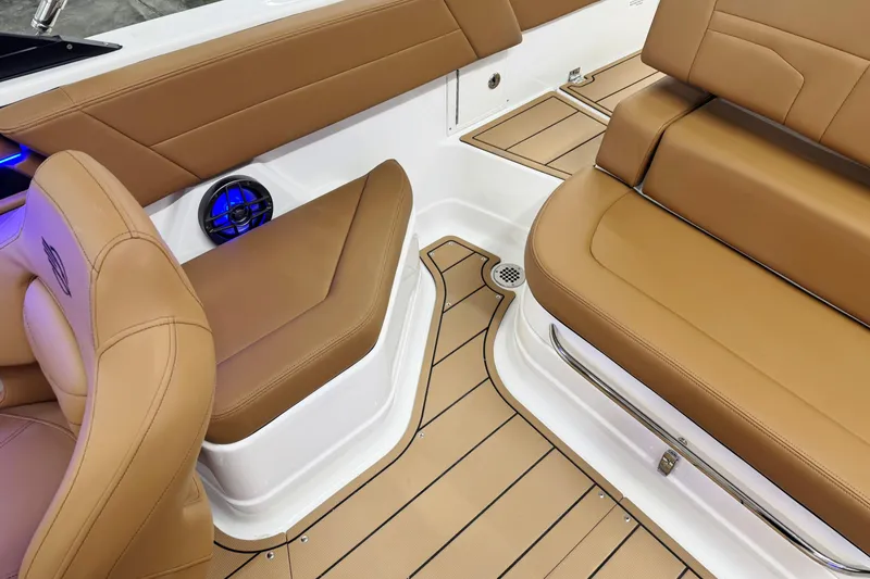 Slide: The Image of 2026 Chaparral SSX 4 boat interior with tan leather seating and modern design. - 25