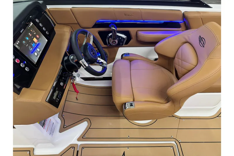Slide: The Image of Luxurious interior of 2026 Chaparral SSX 4 boat with tan leather seating and modern dashboard. - 30