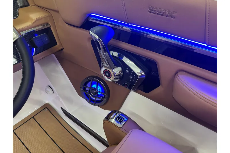 Slide: The Image of Interior of 2026 Chaparral SSX 4 boat with modern controls and blue LED lighting. - 35
