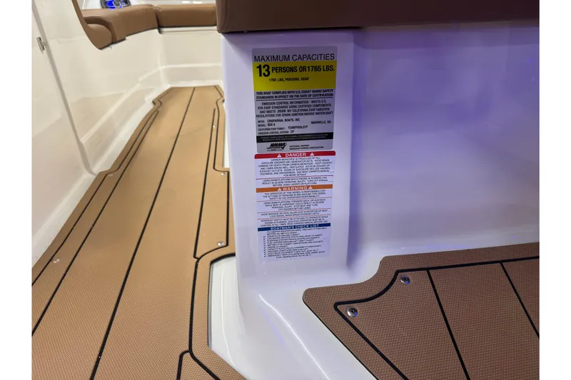 Slide: The Image of 2026 Chaparral SSX 4 boat interior with capacity label for 13 people or 1765 lbs. - 36