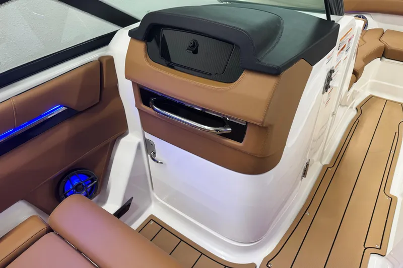 Slide: The Image of 2026 Chaparral SSX 4 boat interior with brown leather seating and modern design. - 37
