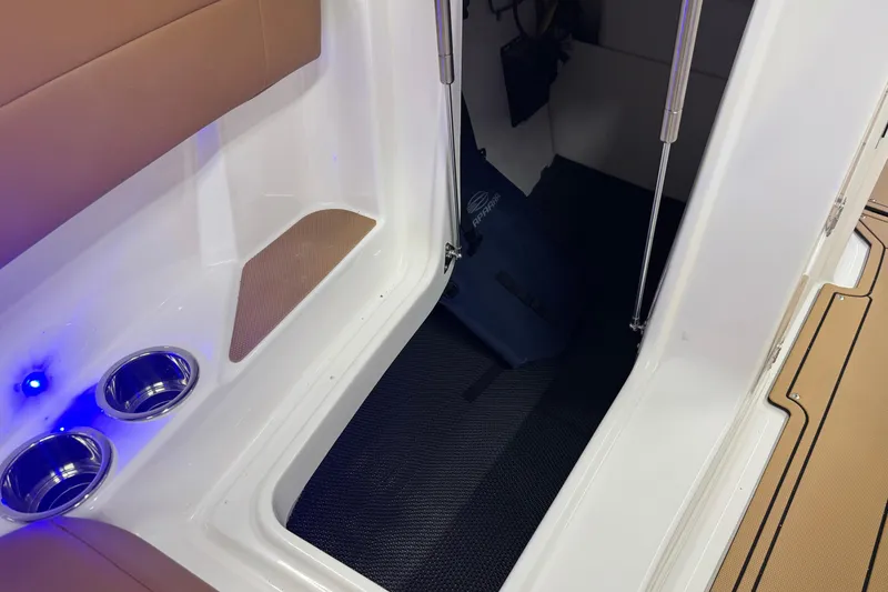 Slide: The Image of Interior of 2026 Chaparral SSX 4 boat with cup holders and blue LED light. - 44