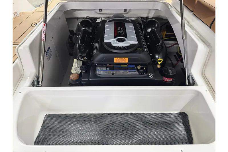 Slide: The Image of 2026 Chaparral SSX 4 boat engine compartment with 6.2L engine, open hatch view. - 45