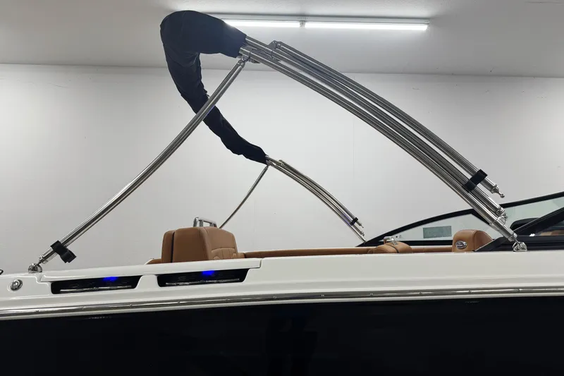 Slide: The Image of 2026 Chaparral SSX 4 boat with sleek design and modern interior in showroom. - 47