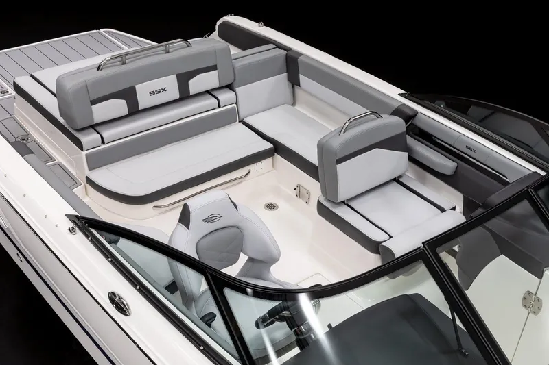 Slide: The Image of 2026 Chaparral SSX 4 boat with teak swim platform and foldable ladder. - 7
