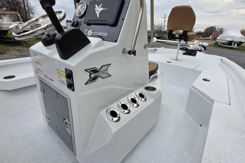 Slide: The Image of 2026 Xpress H20B Bay boat console with steering wheel and seating. - 11