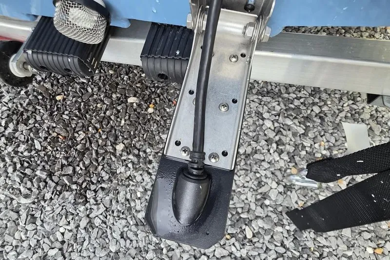 Slide: The Image of Close-up of 2026 Xpress H20B Bay boat trailer hitch on gravel. - 12