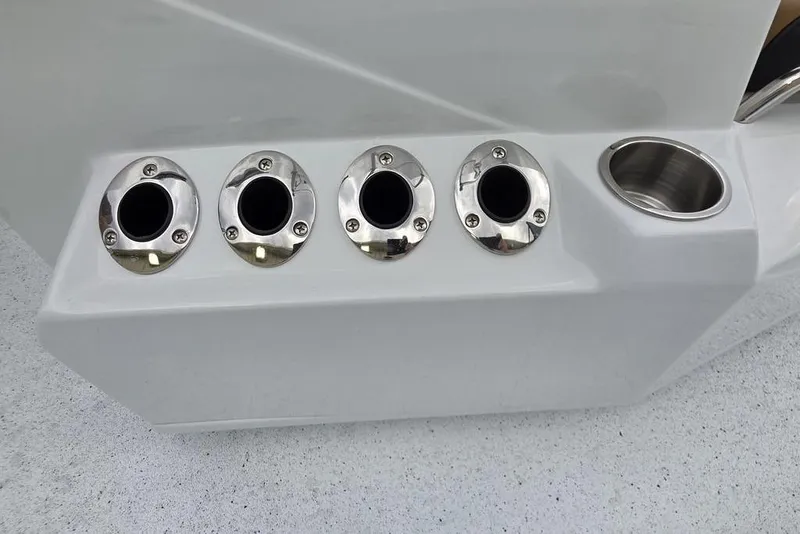 Slide: The Image of 2026 Xpress H20B Bay boat rod holders and cup holder detail. - 16