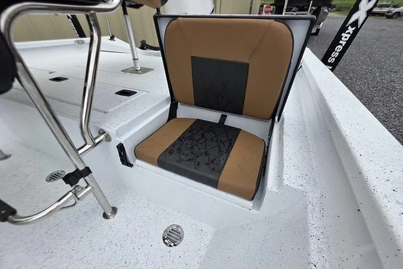 Slide: The Image of 2026 Xpress H20B Bay boat seat with brown and black upholstery. - 26