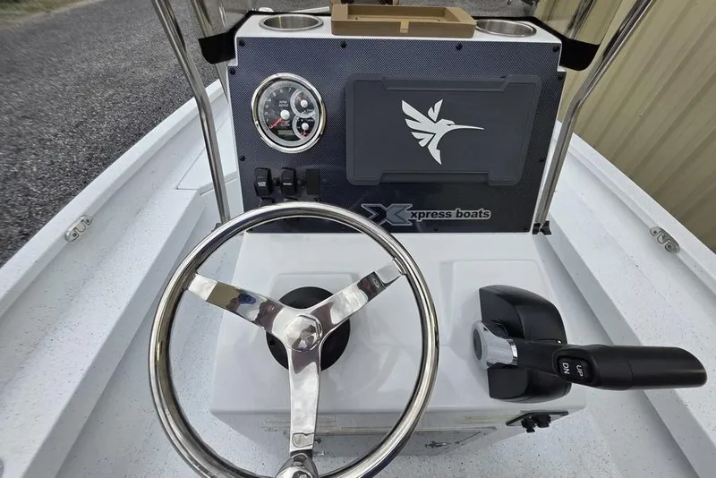 Slide: The Image of Steering console of 2026 Xpress H20B Bay boat with controls and gauges. - 27