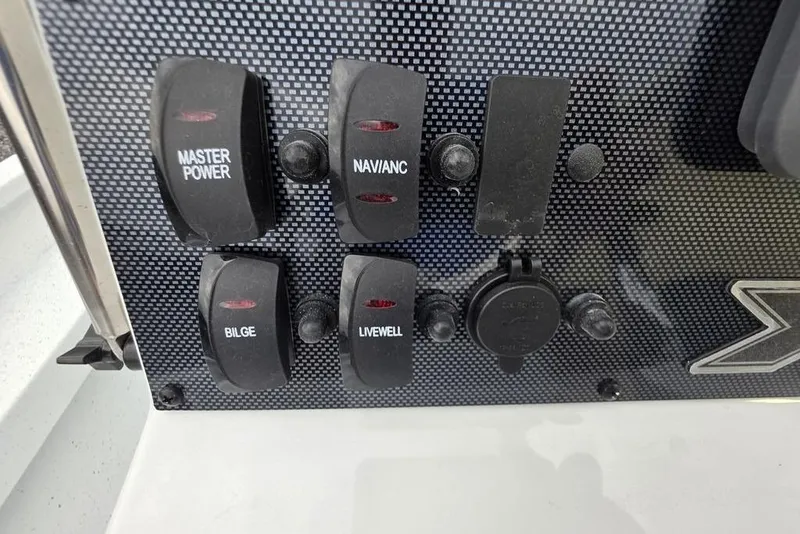 Slide: The Image of Control panel of 2026 Xpress H20B Bay boat with labeled switches. - 31