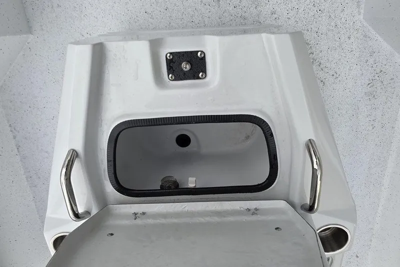 Slide: The Image of 2026 Xpress H20B Bay boat compartment with stainless steel handles and cup holders. - 35