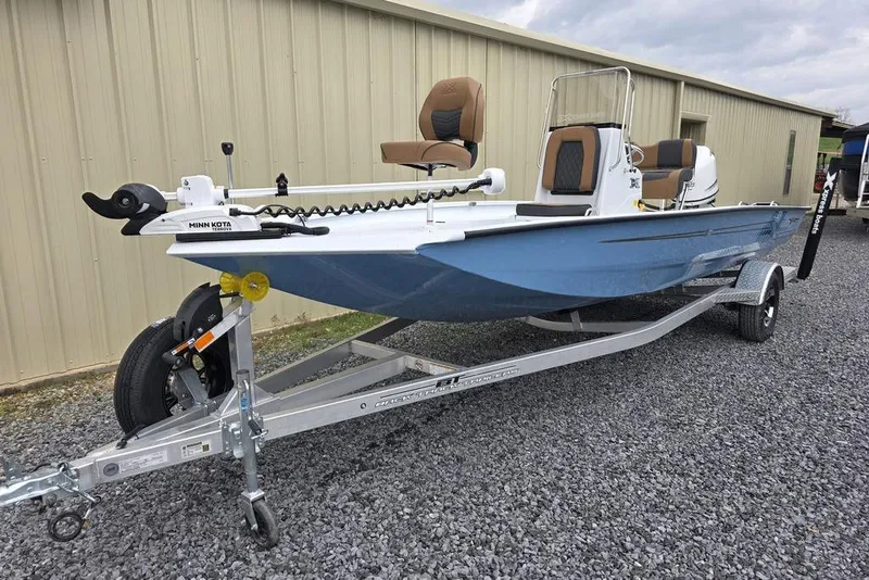 Slide: The Image of 2026 Xpress H20B Bay boat on trailer, featuring Minn Kota trolling motor. - 5