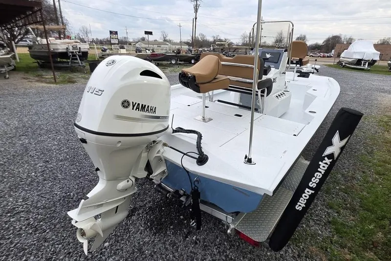 Slide: The Image of 2026 Xpress H20B Bay boat with Yamaha 115 engine, parked on gravel. - 8