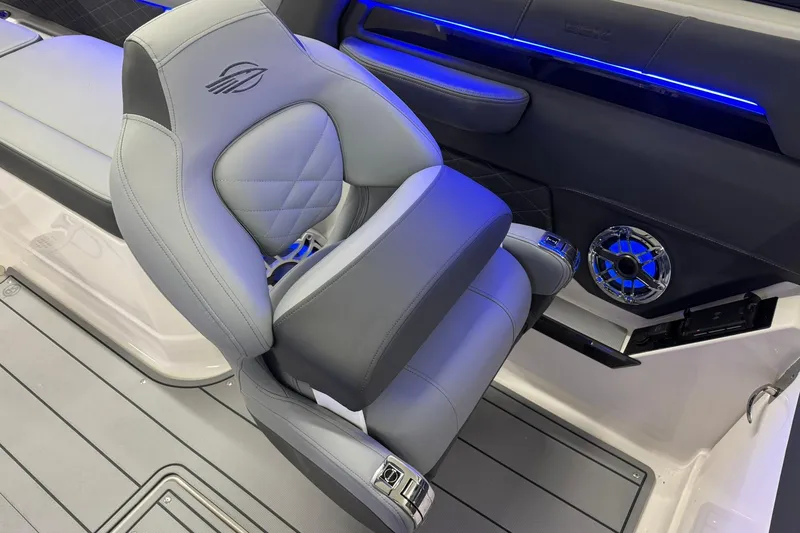 Slide: The Image of Luxury seating in 2026 Chaparral SSX 6 boat with blue LED lighting and speaker. - 22