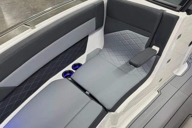 Slide: The Image of 2026 Chaparral SSX 6 boat interior with sleek gray seating and cup holders. - 38