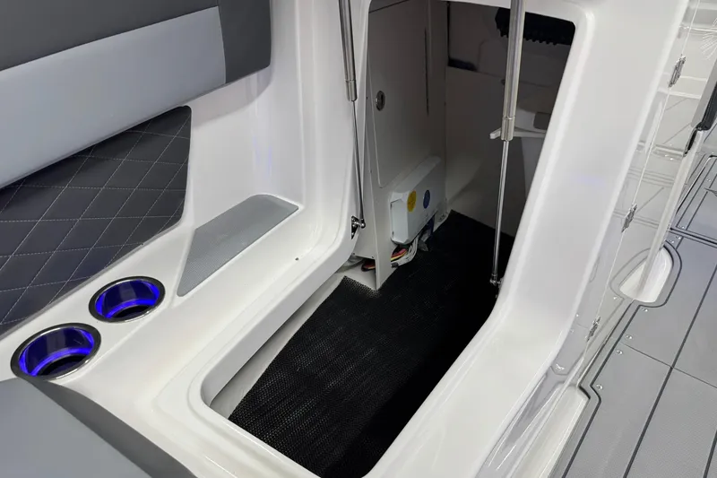 Slide: The Image of 2026 Chaparral SSX 6 interior with cup holders and storage compartment. - 40