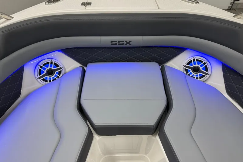 Slide: The Image of 2026 Chaparral SSX 6 boat interior with blue LED lighting and premium seating. - 36