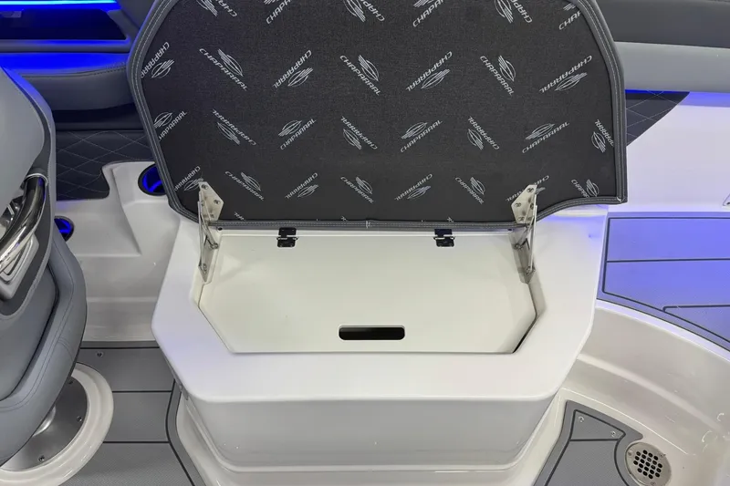 Slide: The Image of 2026 Chaparral SSX 6 boat storage compartment with branded interior lid. - 29