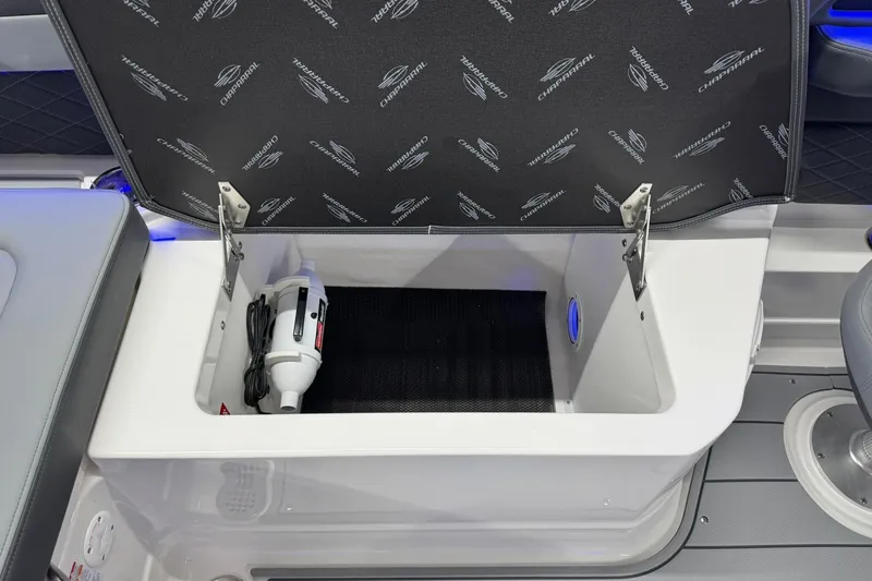 Slide: The Image of Storage compartment in 2026 Chaparral SSX 6 boat, featuring a neatly stored accessory. - 27