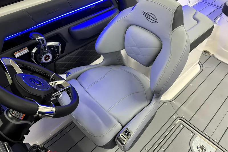 Slide: The Image of 2026 Chaparral SSX 6 boat interior with luxury seating and modern steering wheel design. - 18