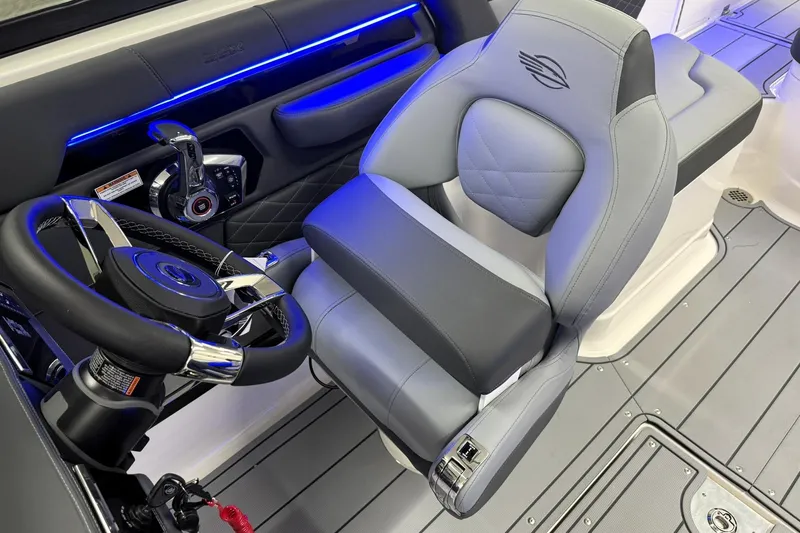 Slide: The Image of 2026 Chaparral SSX 6 boat interior with modern steering and luxurious seating. - 19